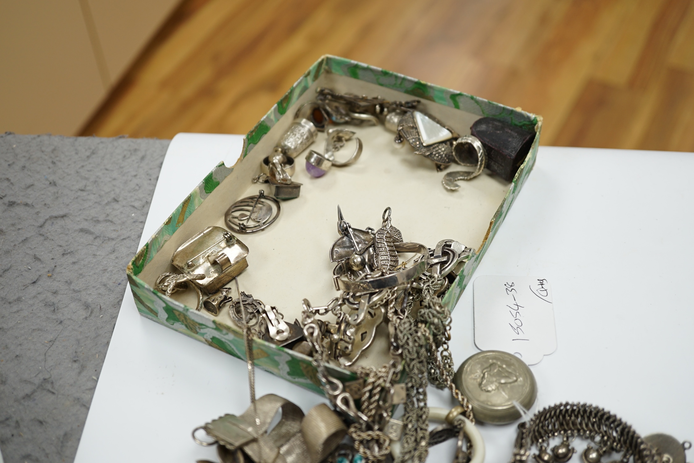 A small quantity of assorted silver and mainly white metal jewellery, including necklaces, brooches, thimbles, bracelets, pendants etc. Condition - poor to fair